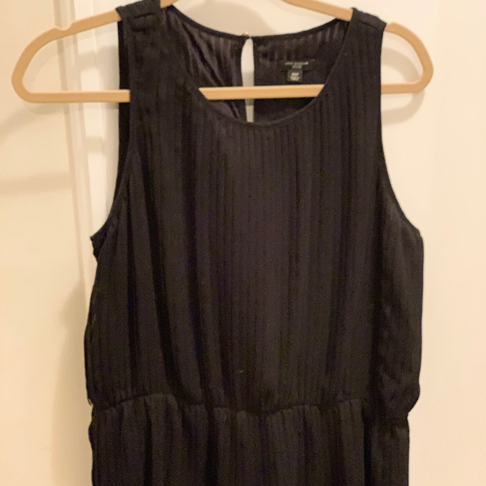 Black sleeveless peplum blouse